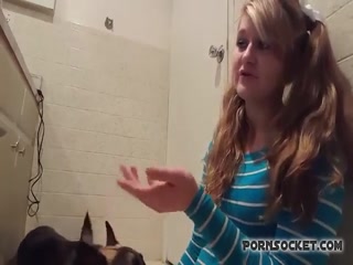 Blonde curly girl seduce her dog 